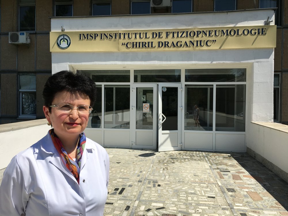 Dr. Elena Tudor in front of the Institute of Phthisiopneumology “Chiril Draganiuc” in Chisinau, Moldova.